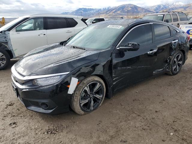 HONDA CIVIC TOUR 2016 with VIN 2HGFC1F97GH652330 - Photo from auction