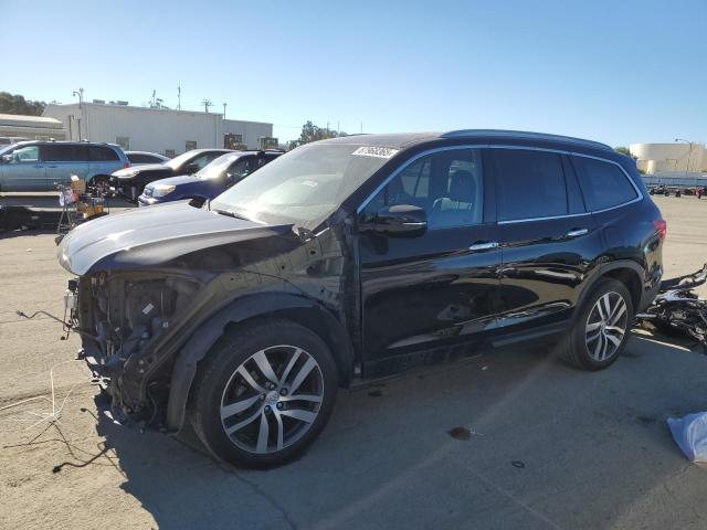 HONDA PILOT TOUR 2017 with VIN 5FNYF5H95HB010845 - Photo from auction