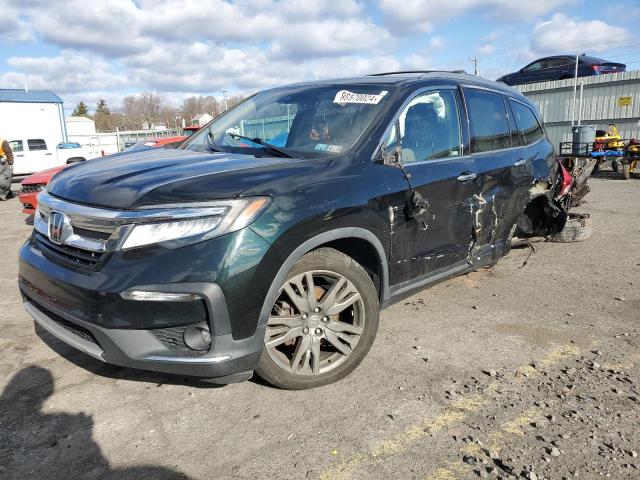 HONDA PILOT TOUR 2019 with VIN 5FNYF6H91KB006952 - Photo from auction