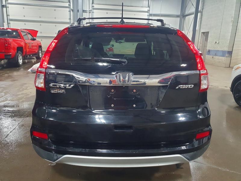 Photo 6 from auction – 2015 HONDA CR-V with VIN 2HKRM4H74FH613884