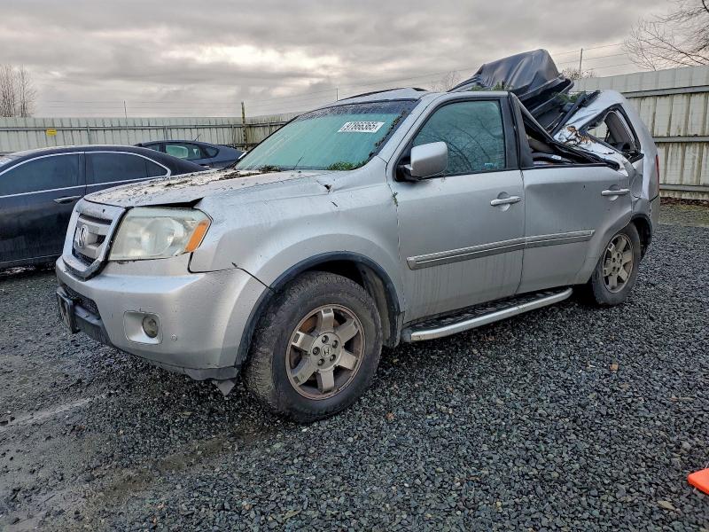 Photo 1 from auction – 2011 HONDA PILOT TOUR with VIN 5FNYF4H90BB056066