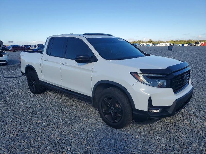 Photo 4 from auction – 2022 HONDA RIDGELINE with VIN 5FPYK3F85NB034253