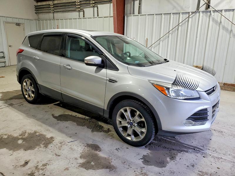 Photo 4 from auction – 2013 FORD ESCAPE with VIN 1FMCU9H98DUC25592