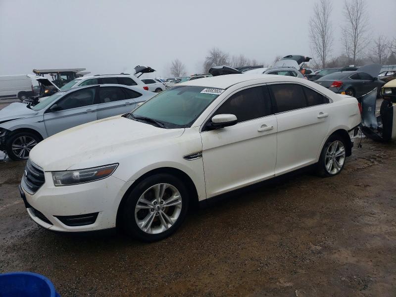 FORD TAURUS SEL 2015 with VIN 1FAHP2E8XFG123318 - Photo from auction