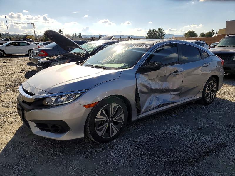 HONDA CIVIC EX 2017 with VIN 2HGFC1F39HH634005 - Photo from auction