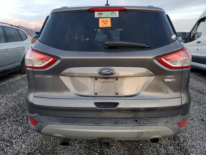 Foto 6 de la subasta – 2014 FORD ESCAPE con VIN 1FMCU9G97EUA13429