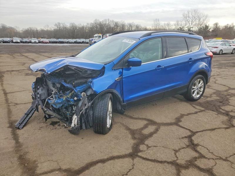 FORD ESCAPE 2019 with VIN 1FMCU9HD8KUB73429 - Photo from auction