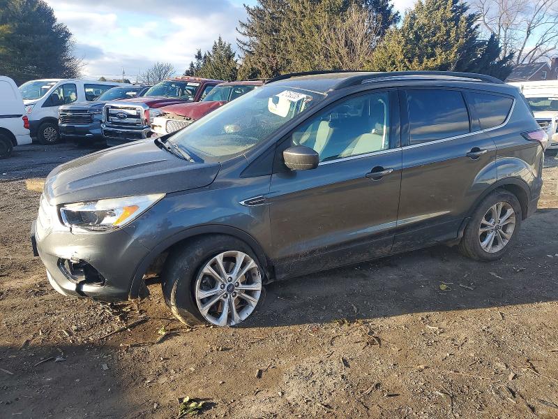 FORD ESCAPE 2018 with VIN 1FMCU9GD9JUC19110 - Photo from auction