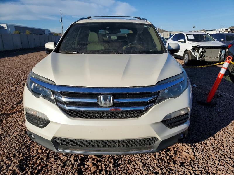 Photo 5 from auction – 2016 HONDA PILOT TOUR with VIN 5FNYF5H92GB052677