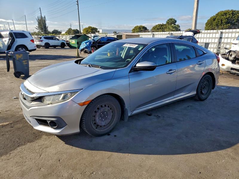 Photo 1 from auction – 2018 HONDA CIVIC LX with VIN 19XFC2F60JE023439