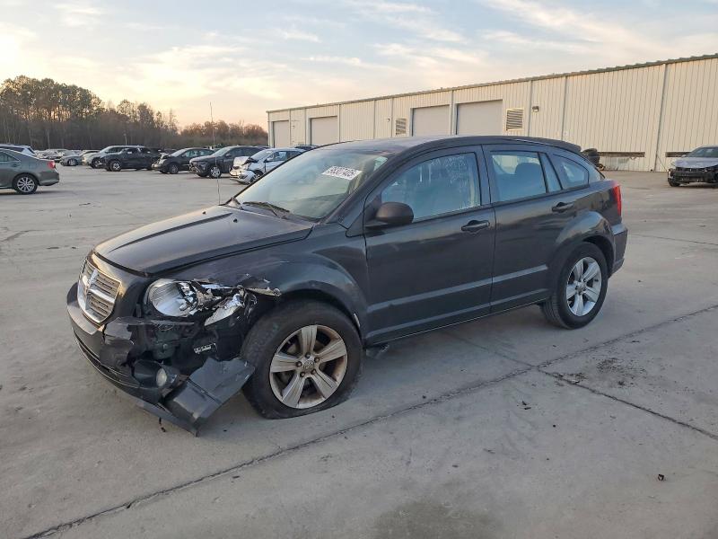 DODGE CALIBER MA 2011 with VIN 1B3CB3HA2BD110857 - Photo from auction