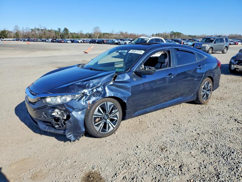 HONDA CIVIC EX 2017 with VIN 19XFC1E35HE027627 - Photo from auction