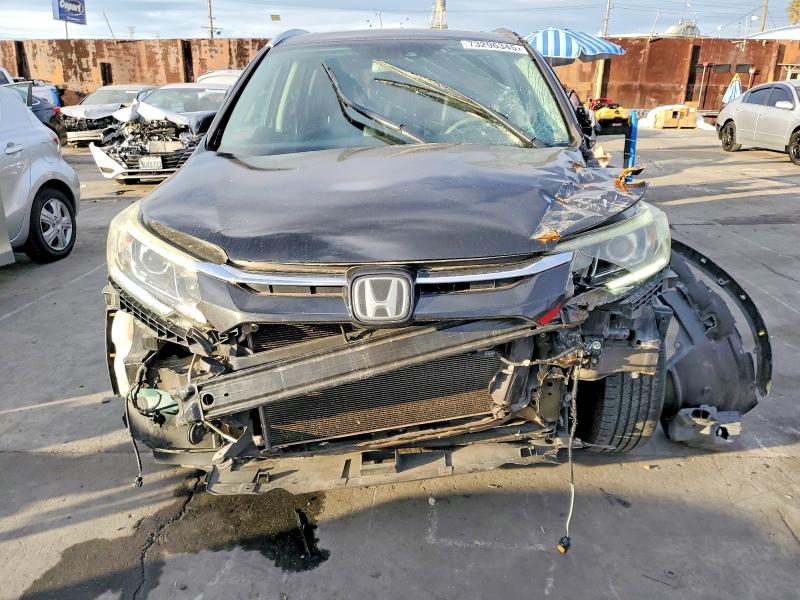 Photo 5 from auction – 2015 HONDA CR-V with VIN 5J6RM3H9XFL002789