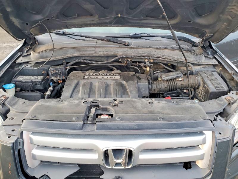Photo 12 from auction – 2006 HONDA PILOT EX with VIN 2HKYF18476H549592