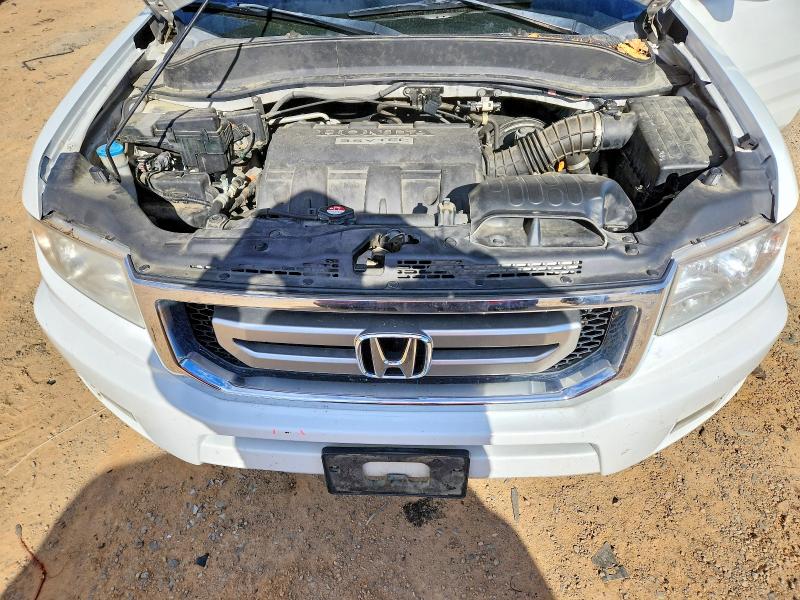 Photo 12 from auction – 2011 HONDA RIDGELINE with VIN 5FPYK1F59BB005750