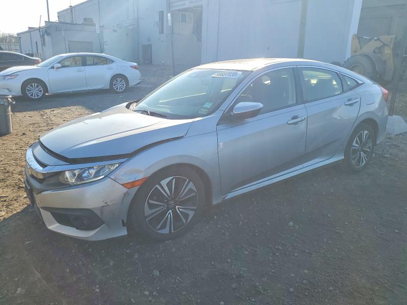 HONDA CIVIC EX 2018 with VIN JHMFC1F41JX028706 - Photo from auction