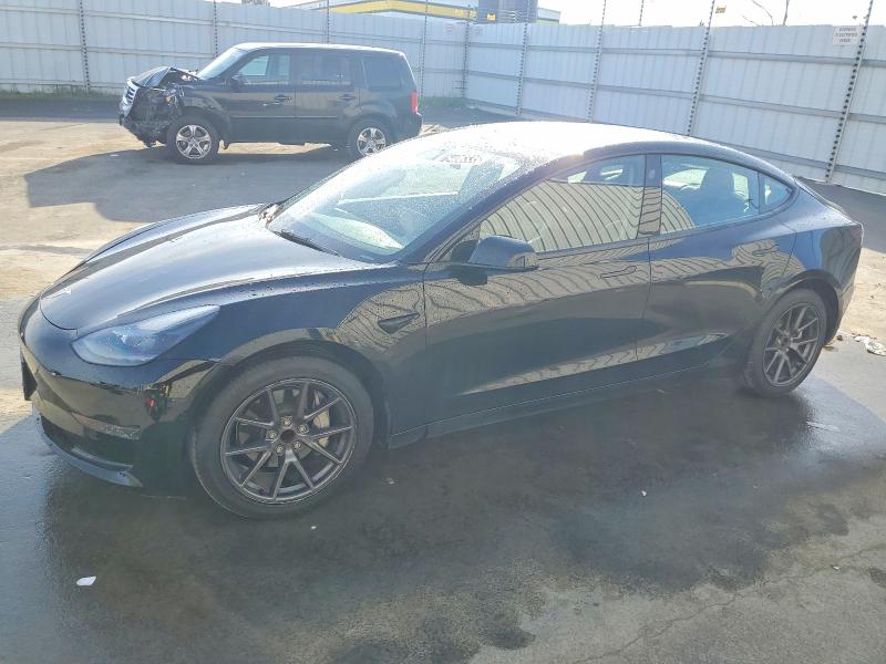 TESLA MODEL 3 2022 with VIN 5YJ3E1EA0NF288021 - Photo from auction