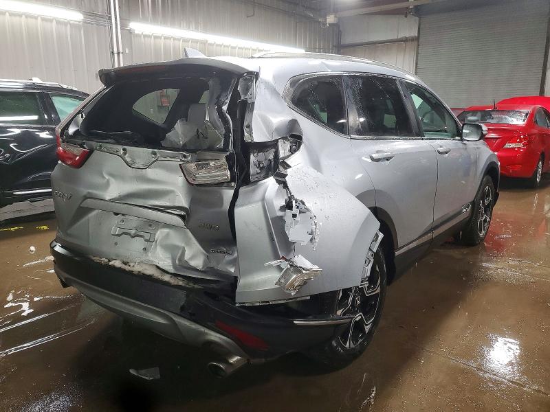 Photo 3 from auction – 2018 HONDA CR-V TOURI with VIN 7FARW2H97JE070753