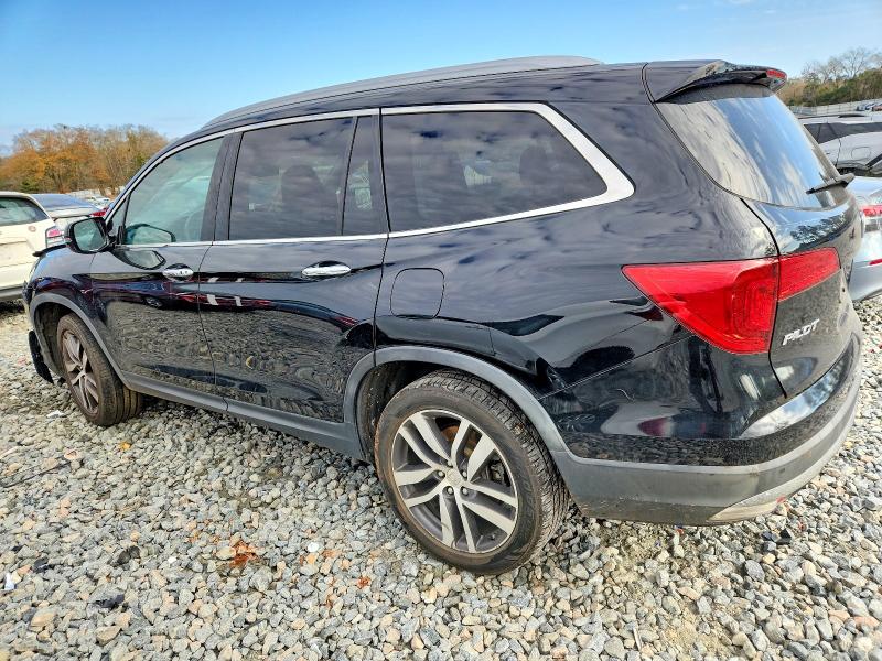 Photo 2 from auction – 2017 HONDA PILOT TOUR with VIN 5FNYF5H98HB045671