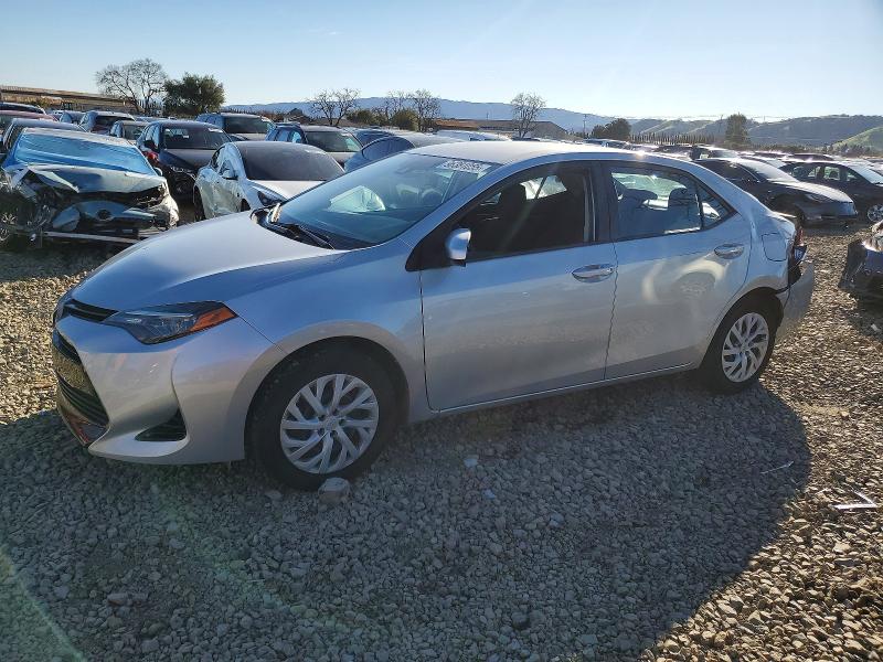 TOYOTA COROLLA 2019 with VIN 5YFBURHE0KP878814 - Photo from auction