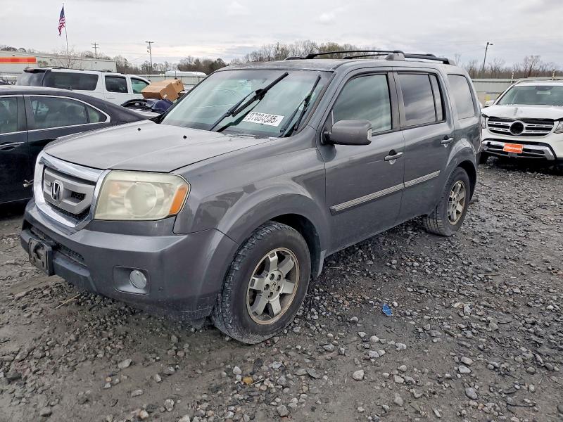 HONDA PILOT TOUR 2010 with VIN 5FNYF4H93AB021908 - Photo from auction