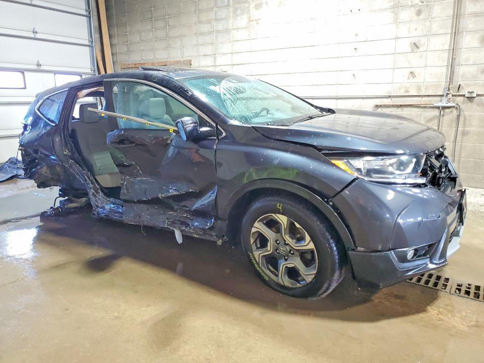 Photo 4 from auction – 2017 HONDA CR-V with VIN 5J6RW2H81HL023898
