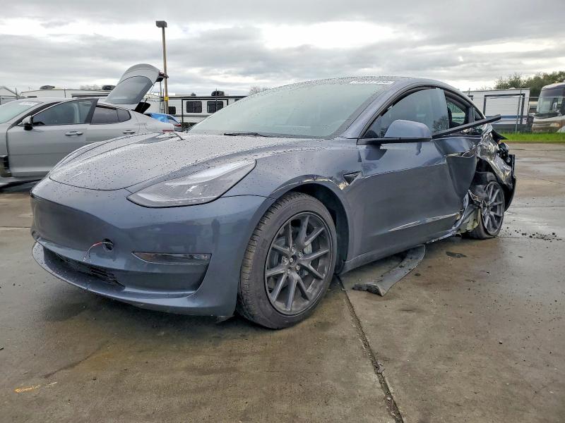 TESLA MODEL 3 2023 with VIN 5YJ3E1EB2PF629883 - Photo from auction