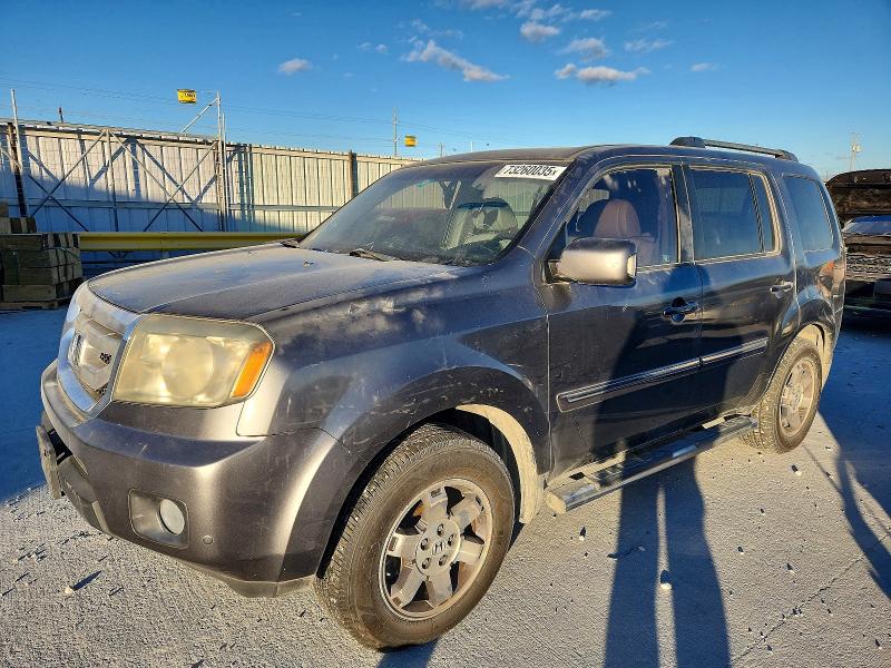 HONDA PILOT TOUR 2011 with VIN 5FNYF3H98BB003836 - Photo from auction