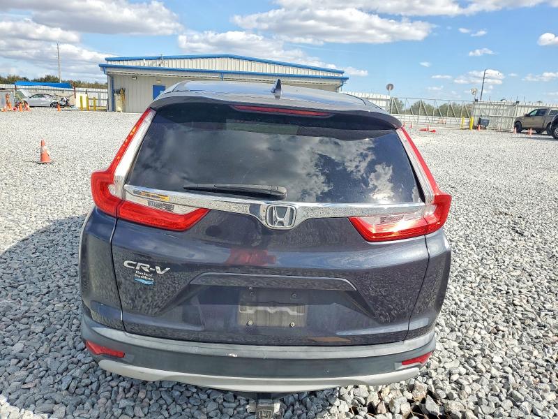 Photo 6 from auction – 2017 HONDA CR-V with VIN 7FARW1H8XHE014298
