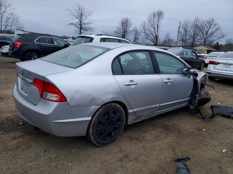 Photo 3 from auction – 2011 HONDA CIVIC LX with VIN 19XFA1F50BE042565