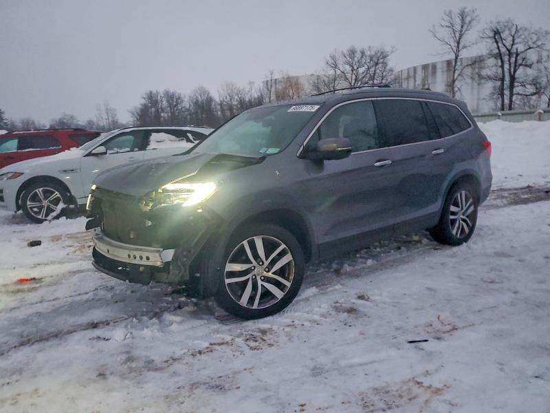 HONDA PILOT ELIT 2016 with VIN 5FNYF6H02GB117549 - Photo from auction
