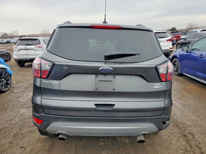 Photo 6 from auction – 2018 FORD ESCAPE with VIN 1FMCU9GDXJUC14577