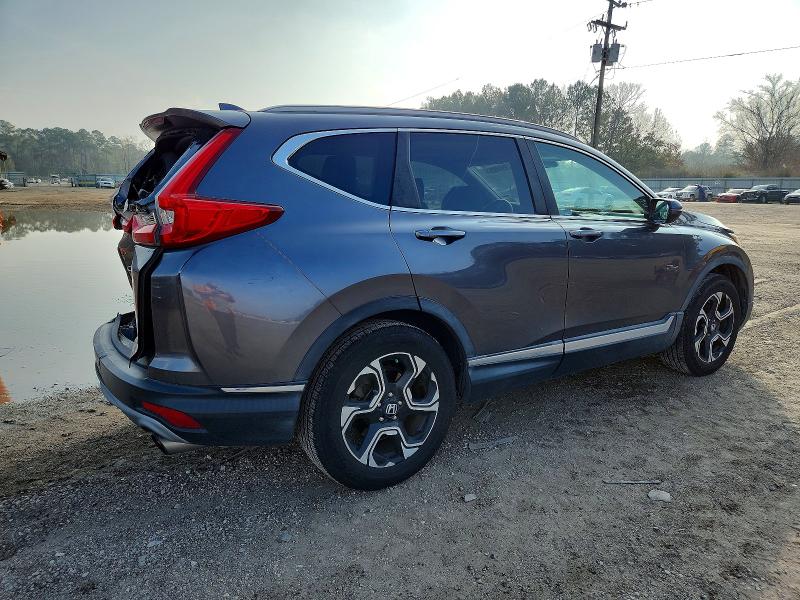Photo 3 from auction – 2017 HONDA CR-V with VIN 2HKRW1H99HH509050