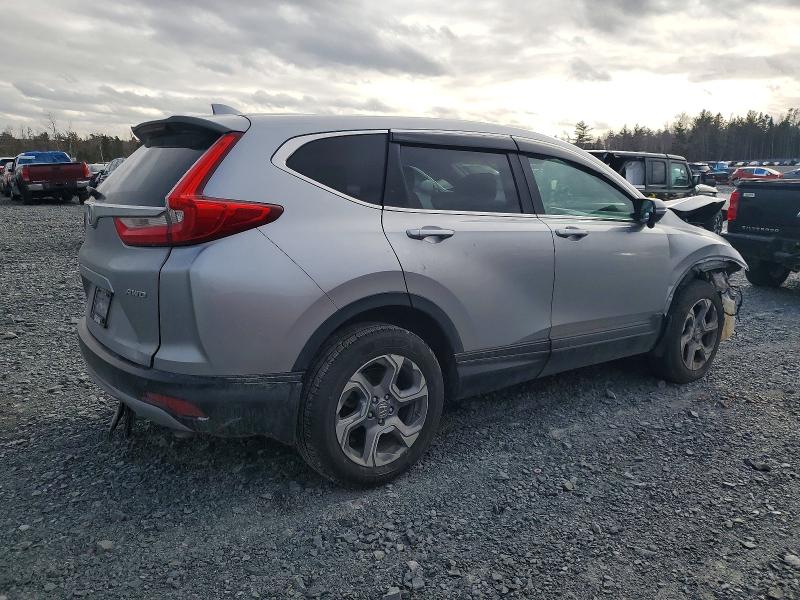 Photo 3 from auction – 2018 HONDA CR-V with VIN 2HKRW2H53JH115276