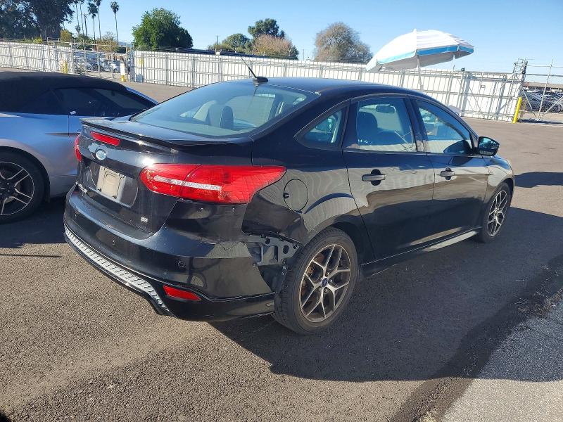 Photo 3 from auction – 2016 FORD FOCUS SE with VIN 1FADP3F21GL384165