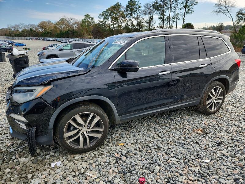 HONDA PILOT TOUR 2017 with VIN 5FNYF5H98HB045671 - Photo from auction