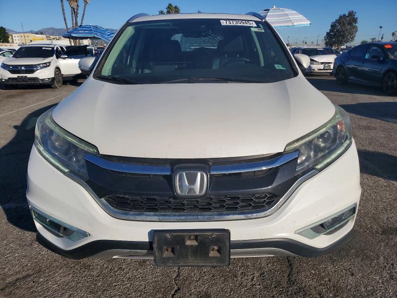 Photo 5 from auction – 2015 HONDA CR-V with VIN 5J6RM3H93FL024665