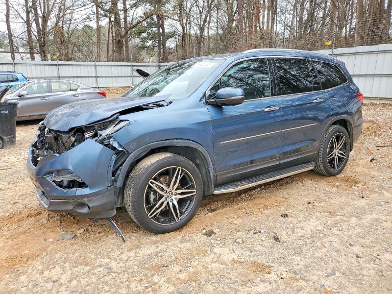 HONDA PILOT TOUR 2017 with VIN 5FNYF5H90HB019128 - Photo from auction