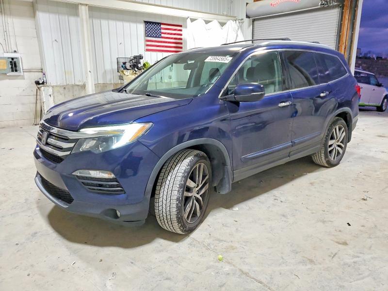 HONDA PILOT TOUR 2017 with VIN 5FNYF6H99HB022745 - Photo from auction