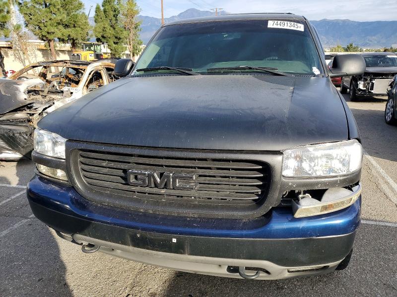 Photo 5 from auction – 2003 GMC YUKON with VIN 1GKEC13V03R224626