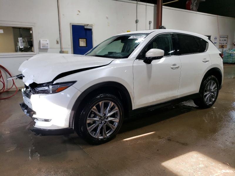 MAZDA CX-5 2021 with VIN JM3KFBAYXM0373843 - Photo from auction