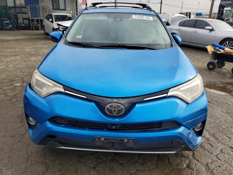 Photo 5 from auction – 2018 TOYOTA RAV4 with VIN 2T3YFREV9JW470244