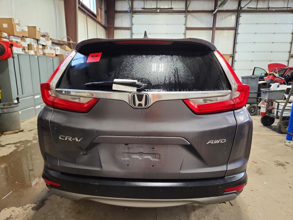Photo 6 from auction – 2017 HONDA CR-V LX with VIN 2HKRW2H21HH102915