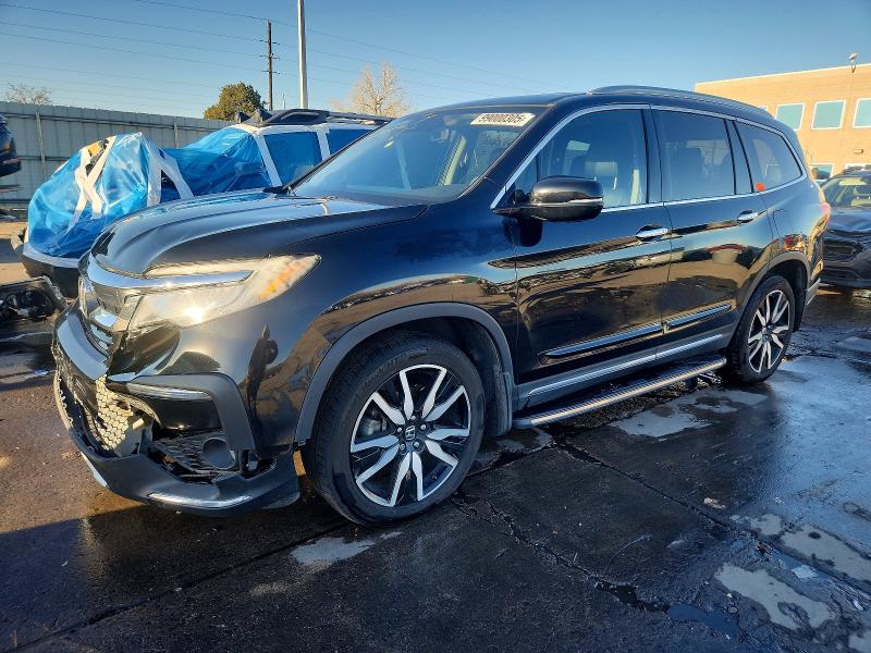 HONDA PILOT TOUR 2019 with VIN 5FNYF6H97KB053936 - Photo from auction