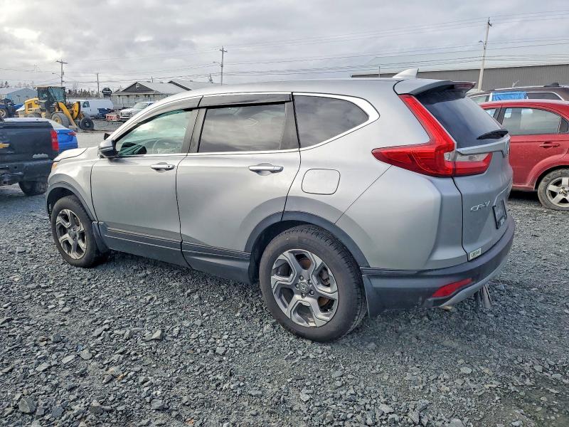 Photo 2 from auction – 2018 HONDA CR-V with VIN 2HKRW2H53JH115276