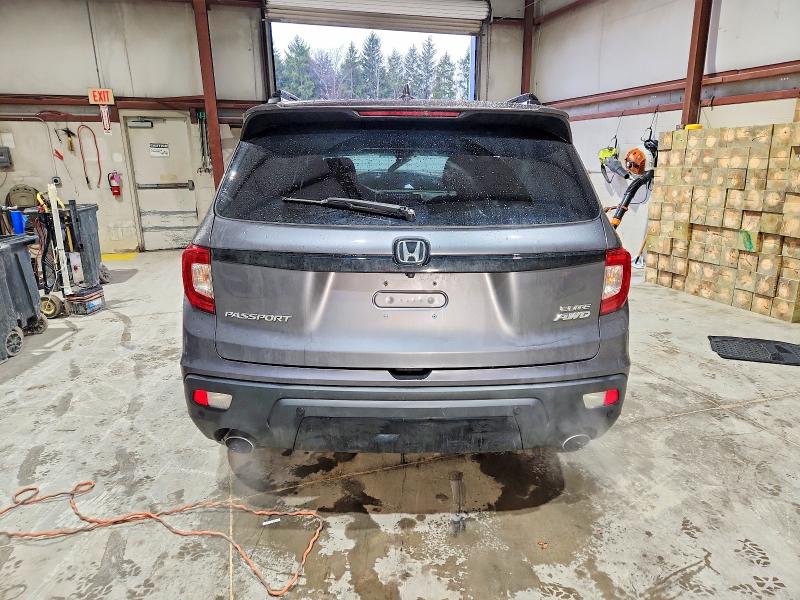 Photo 6 from auction – 2021 HONDA PASSPORT E with VIN 5FNYF8H03MB010663