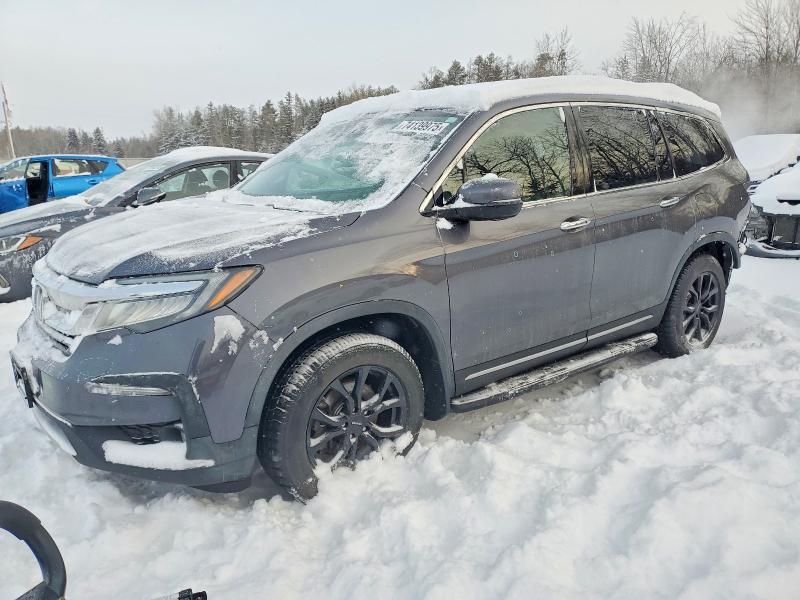HONDA PILOT TOUR 2020 with VIN 5FNYF6H93LB500618 - Photo from auction