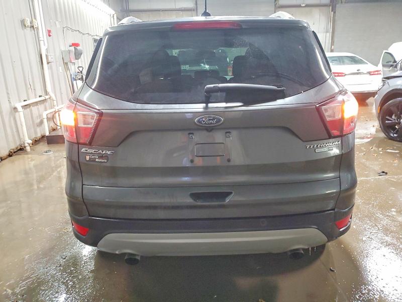 Photo 6 from auction – 2018 FORD ESCAPE with VIN 1FMCU9J98JUC55813