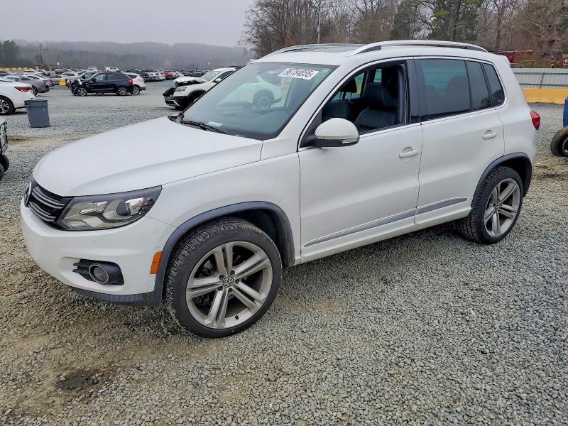 VOLKSWAGEN TIGUAN 2014 with VIN WVGAV3AX4EW100735 - Photo from auction