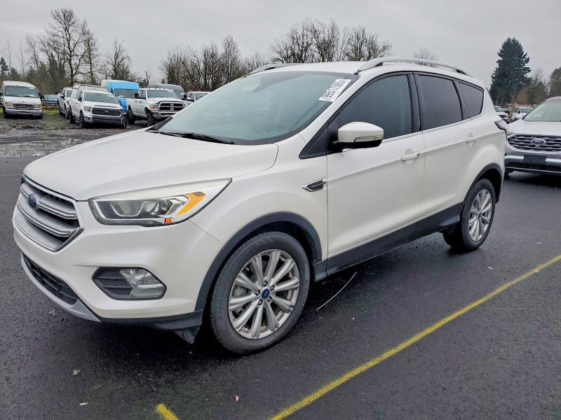 FORD ESCAPE TIT 2017 with VIN 1FMCU0J98HUB44748 - Photo from auction